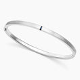 Brushed Silver Bangle Bracelet with Baguette Sapphire Accent
