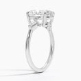 Cometa Oval Cut Three Stone Moissanite Engagement Ring