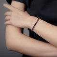 Crimson Glow Round Garnet Tennis Bracelet
