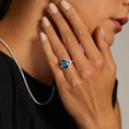 Load image into Gallery viewer, Oval Cut London Blue Topaz and Moissanite Split-Shank Cocktail Ring