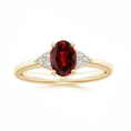 Oval Garnet Engagement Ring with Trio Moissanite Accents