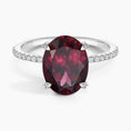 Load image into Gallery viewer, Oval Garnet Hidden Halo Engagement Ring with Moissanite Pavé Band