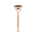 Oval Garnet with Clustered Moissanite Side Accents Engagement Ring