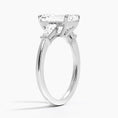 Symphony Three Stone Emerald Cut Moissanite Engagement Ring