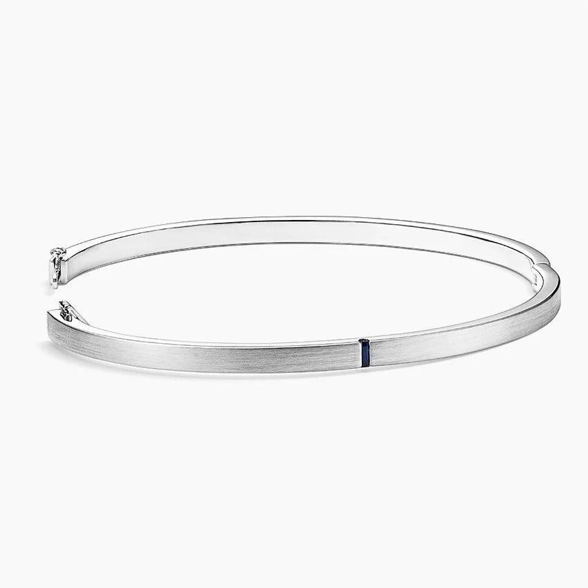 Brushed Silver Bangle Bracelet with Baguette Sapphire Accent