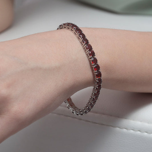Crimson Glow Round Garnet Silver Tennis Bracelet