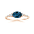 East-West Oval London Blue Topaz Solitaire Engagement Ring with Moissanite Accents