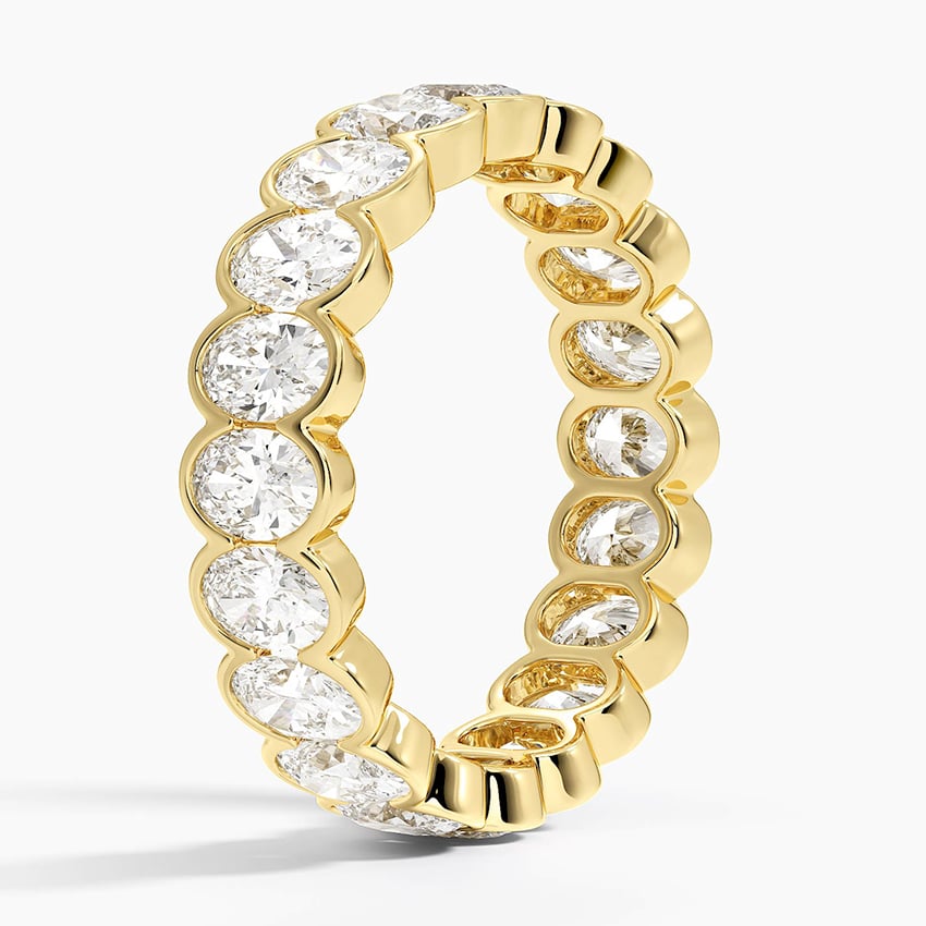 Oval Cut Eternity Moissanite Semi-Bezel Wedding Band–5.2 mm