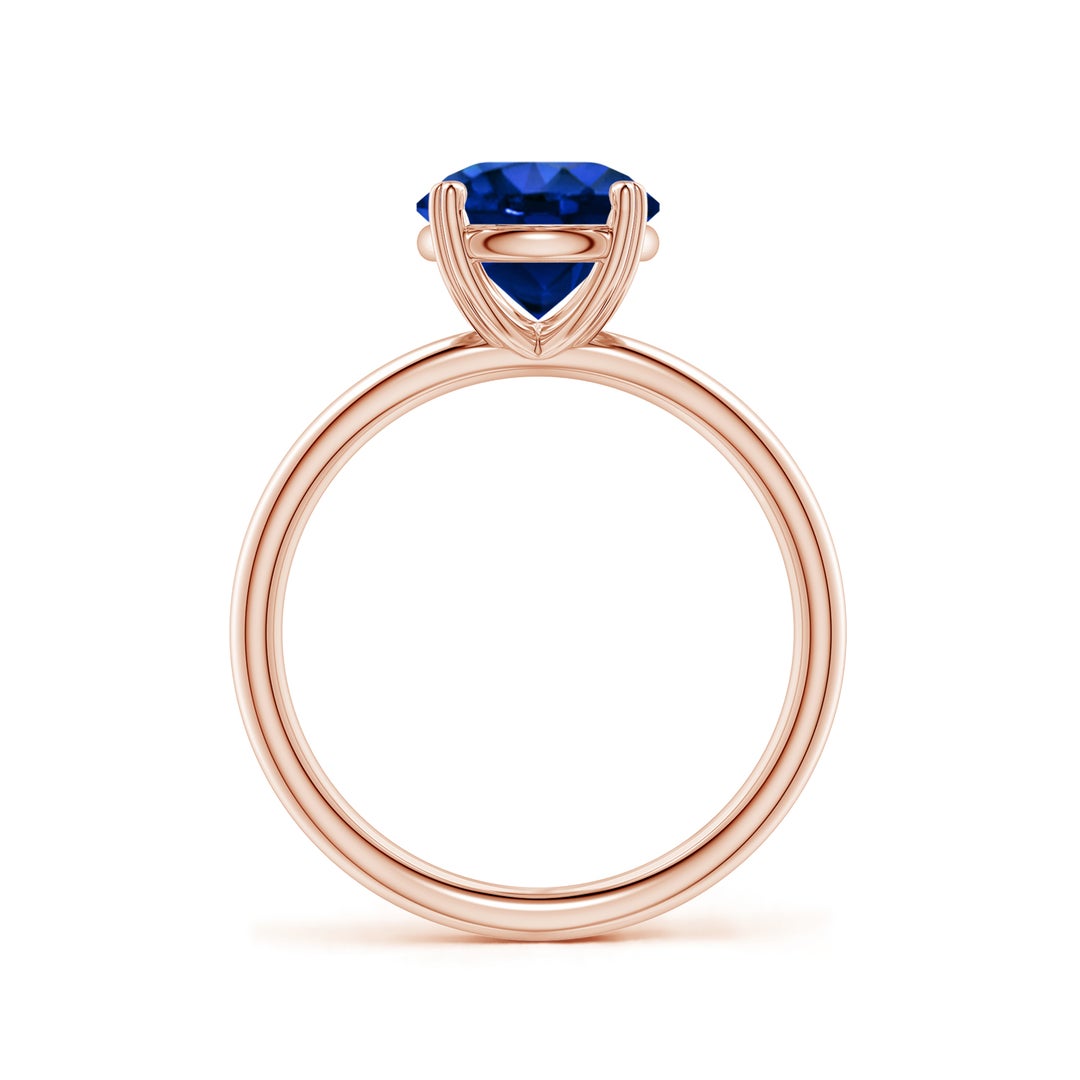 Round Lab-Grown Blue Sapphire Solitaire Engagement Ring with Heart-Shaped Prongs