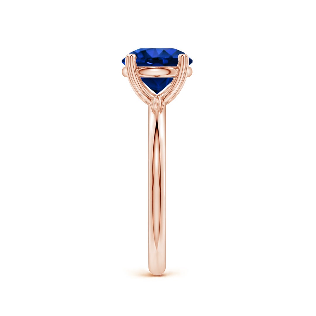 Round Lab-Grown Blue Sapphire Solitaire Engagement Ring with Heart-Shaped Prongs