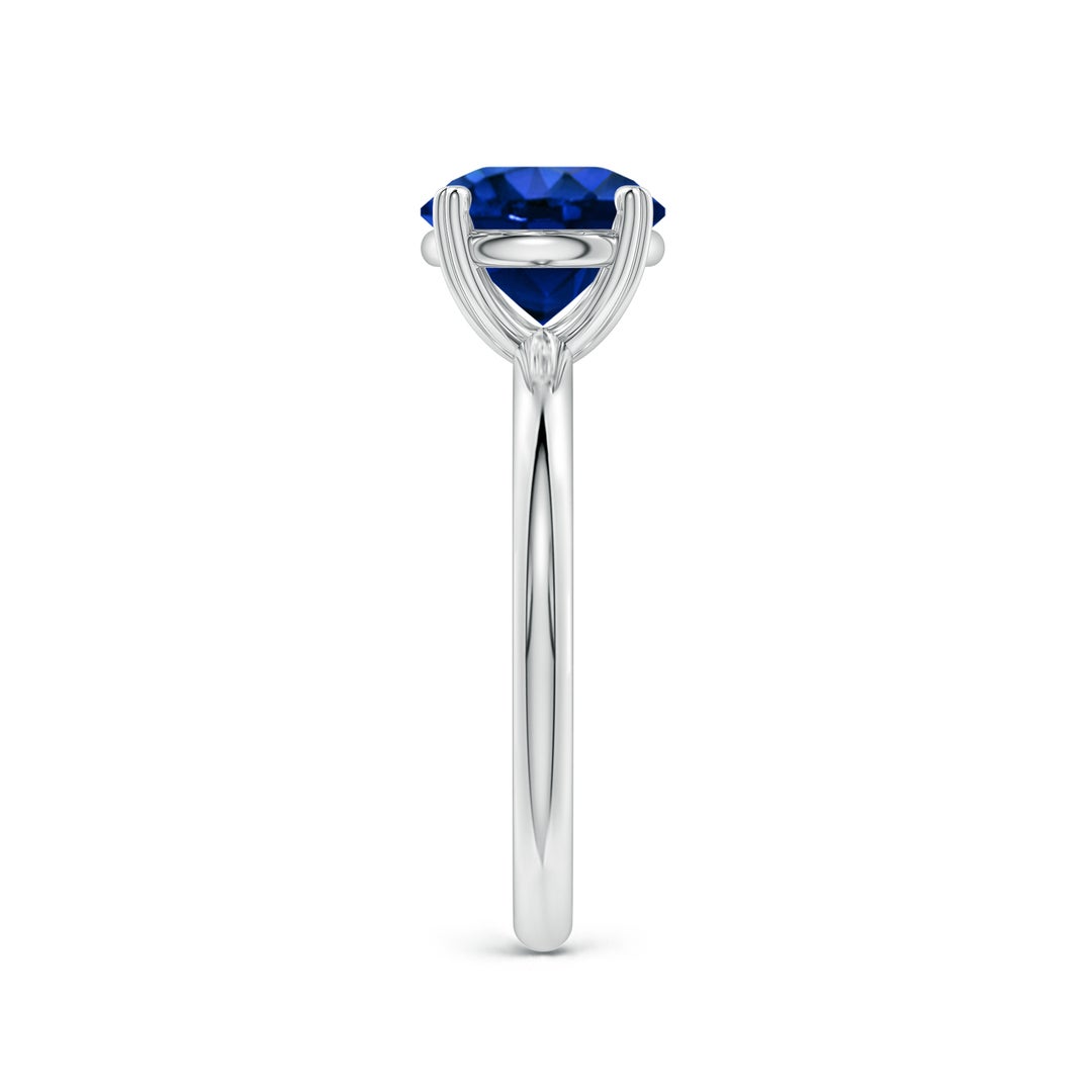 Round Lab-Grown Blue Sapphire Solitaire Engagement Ring with Heart-Shaped Prongs