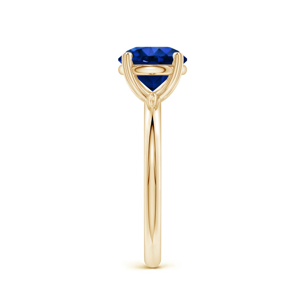 Round Lab-Grown Blue Sapphire Solitaire Engagement Ring with Heart-Shaped Prongs
