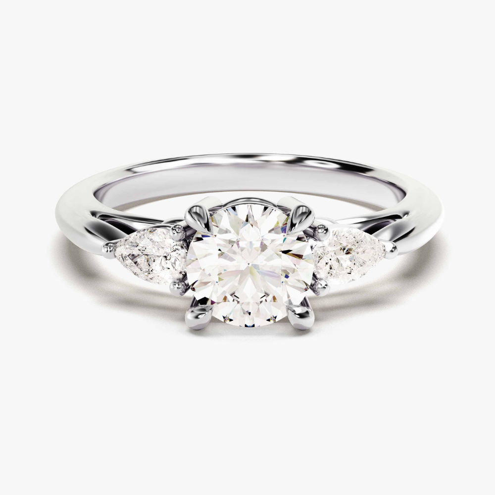 Three‑Stone Moissanite Engagement Ring with Pear‑Cut Accents